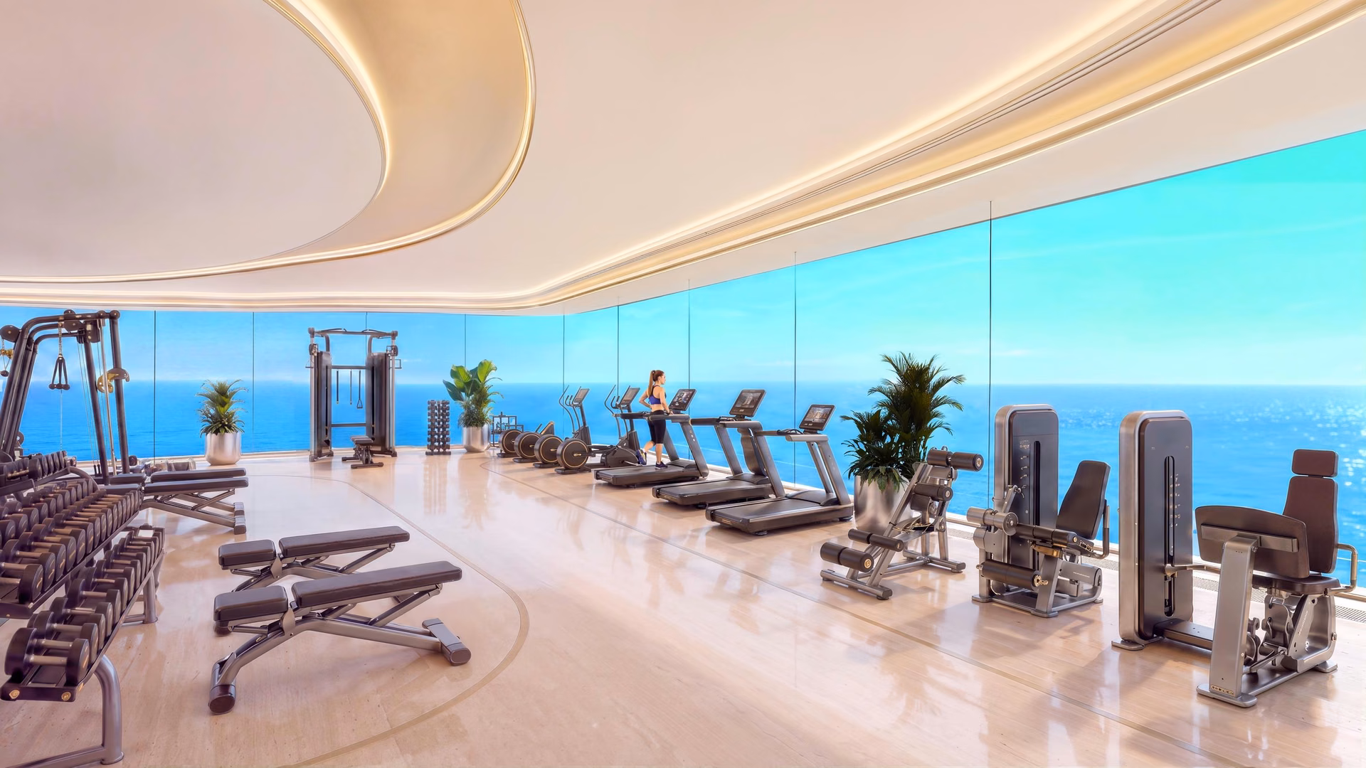 Indoor gym with sea views at Shahrukhz Residences by Danube, Dubai Maritime City
